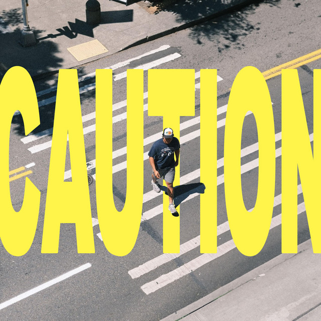 'CAUTION' cover art